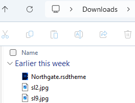Windows Downloads folder showing the Northgate.rsdtheme file highlighted with a red circle